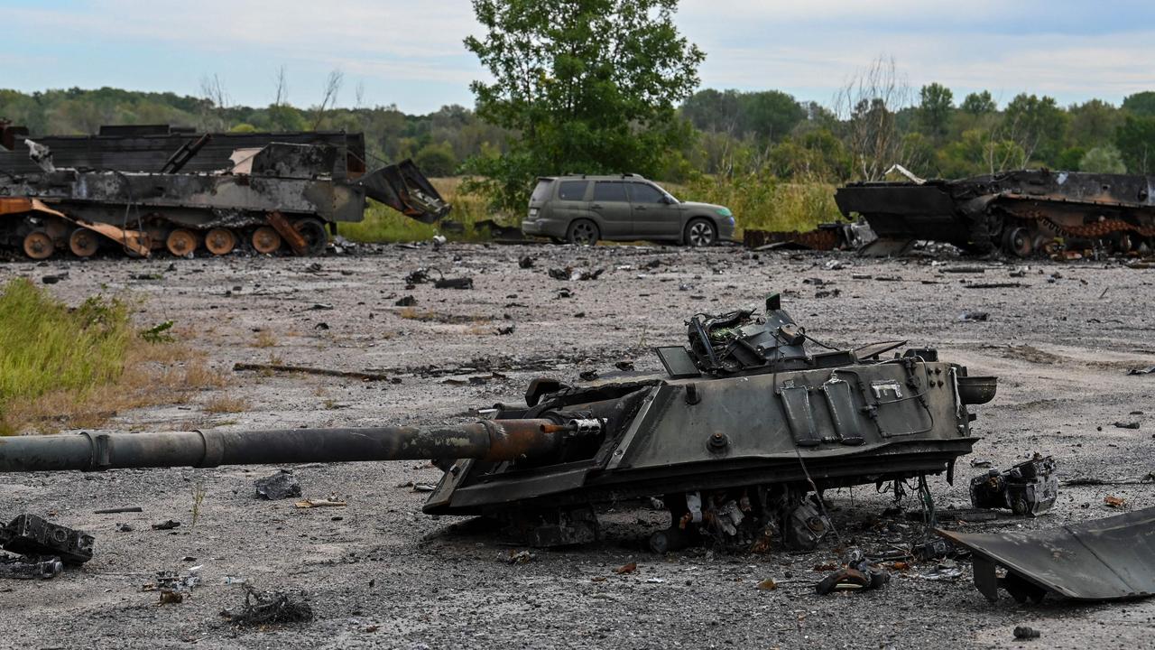 This photograph taken in Balakliya, Kharkiv region, on September 10, 2022 shows a destroyed military tank. (Photo by Juan BARRETO / AFP)