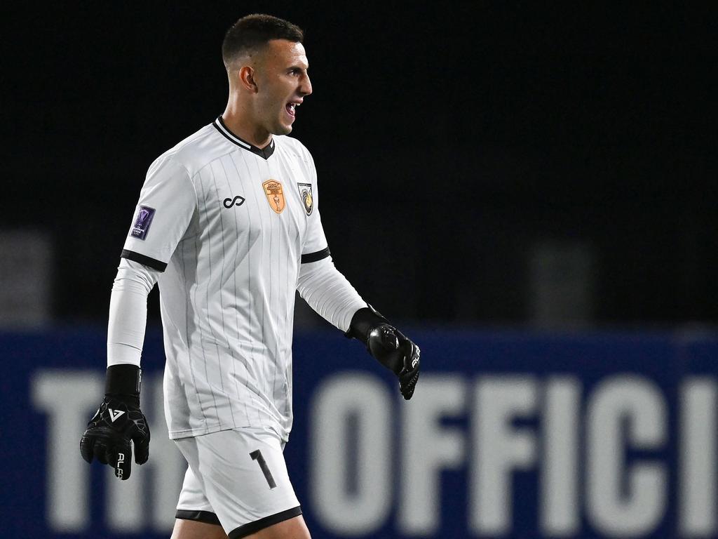 Central Coast Mariners goalkeeper Adam Pavlesic leaves the pitch after being sent off in his side’s 2-1 loss to Buriram United. Picture: Saeed Khan / AFP