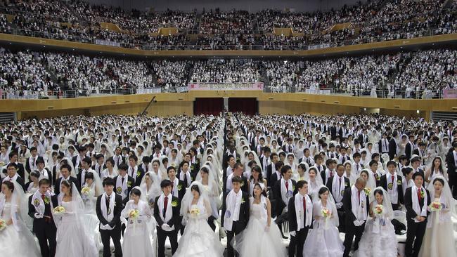 Thousands of couples take part in a mass wedding ceremony at Cheongshim Peace World Centre on February 17, 2013 in Gapyeong-gun, South Korea. Picture: Getty