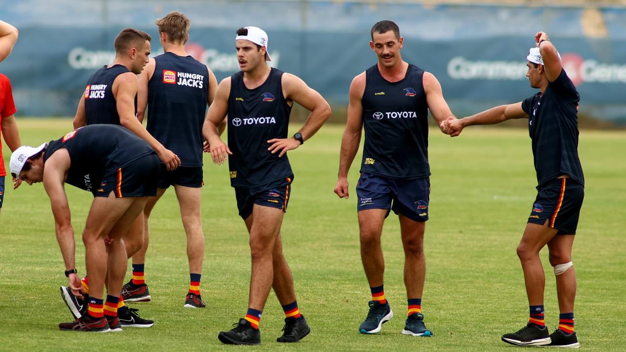 Walker fist pumps with Shane McAdam at Crows training. Picture: Kelly Barnes