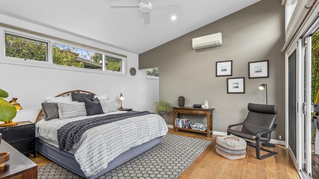 The main bedroom has its own entry to a patio and a north-facing backyard.