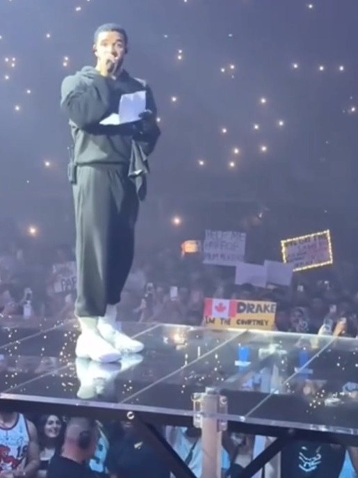 The sign caught the attention of the rapper, who took a moment out of his concert to reveal the big news.