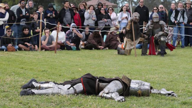 Men battle it out with a sword fight at the Hawkesbury Showground Winterfest Medieval Festival on Saturday, July 7, 2018. The festival drew a large crowd from the Hawkesbury area who came for the food, folk music and fun. (AAP Image/David Swift)