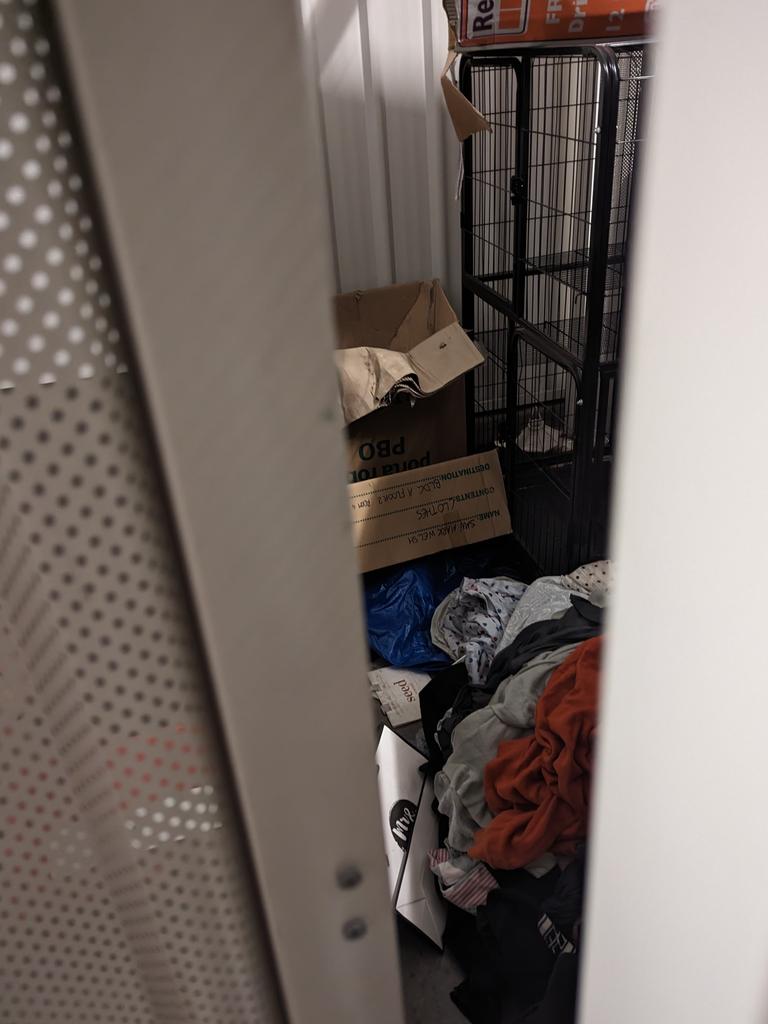 They appeared to be using this cage as a wardrobe.