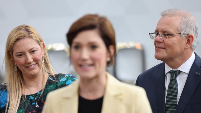 Prime Minister Scott Morrison, right, and Boothby candidate Dr Rachel Swift look on as retiring Liberal Party member for Boothby Nicolle Flint speaks during a tour of Micro X at the Tonsley Innovation District. Picture: NCA NewsWire / David Mariuz