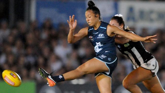 Darcy Vescio kicks a goal against Collingwood.