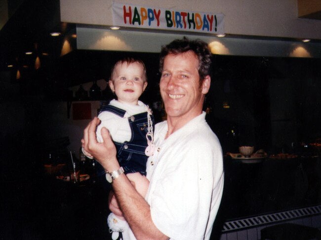 Murder victim infant Laura Folbigg with her father Craig at her 1st birthday party.