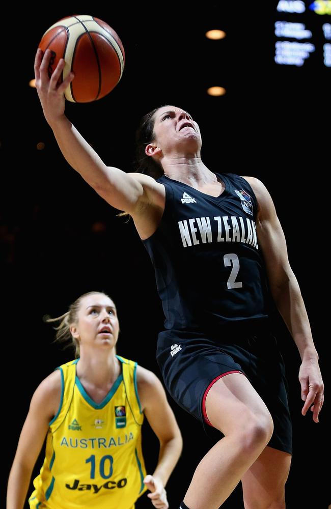 Micaela Cocks of the Tall Ferns drives to the basket.