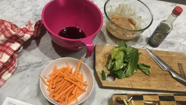 Marley Spoon's Miso Chicken and Noodle Stir-Fry preparation. Picture: Jess Galletly