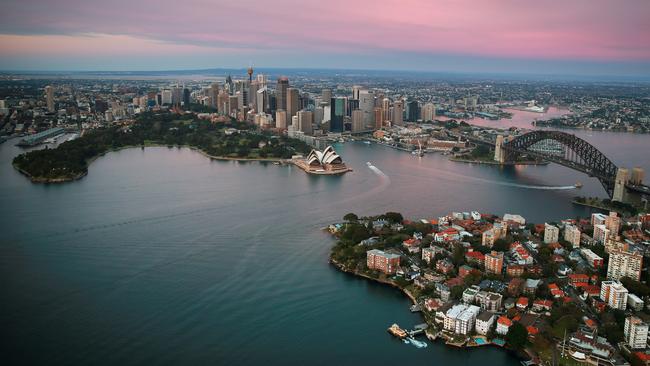 Aerial photos of Sydney CBD, Harbour and Barangaroo at sunrise. Sydney Harbour with Mrs Macquarie's Chair the the left, Kirribilli at the bottom right, Opera House and Harbour Bridge. Picture: Toby Zerna