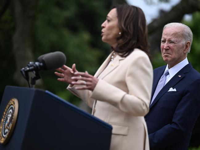 (FILES) US President Joe Biden looks on as US Vice President Kamala Harris delivers remarks during National Small Business Week in the Rose Garden of the White House in Washington, DC, on May 1, 2023. Joe Biden on July 21, 2024 dropped out of the US presidential election and endorsed Vice President Kamala Harris as the Democratic Party's new nominee, in a stunning move that upends an already extraordinary 2024 race for the White House. Biden, 81, said he was acting in the "best interest of my party and the country" by bowing to weeks of pressure after a disastrous June debate against Donald Trump stoked worries about his age and mental fitness. (Photo by Brendan SMIALOWSKI / AFP)