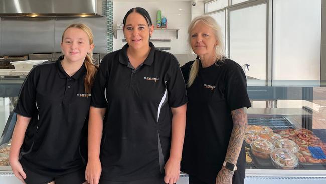 Jacoba Murray, with manager Ashlee Dockery and Kerri Connors from Seaside Takeaway Hervey Bay.