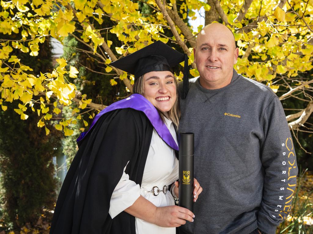 Associate Degree of Criminology and Criminal Justice graduate Delaney Holder with dad Michael Holder at a UniSQ graduation ceremony at Empire Theatres, Tuesday, June 27, 2023. Picture: Kevin Farmer