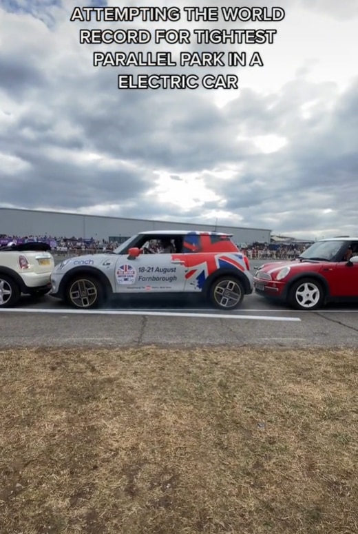 Stunt driver Paul Swift squeezed into a tiny spot, 35cm longer than his electric Mini.
