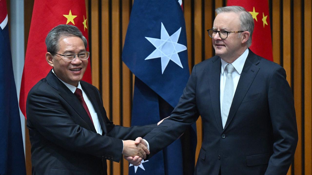 Australia's Prime Minister Anthony Albanese shakes hands with China's Premier Li Qiang during a signing ceremony at Parliament House in Canberra. Photo: Lukas Coch