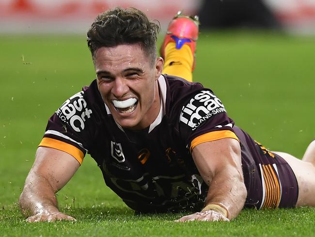 BRISBANE, AUSTRALIA - JULY 30: Brodie Croft of the Broncos scores a try during the round 20 NRL match between the Brisbane Broncos and the North Queensland Cowboys at Suncorp Stadium, on July 30, 2021, in Brisbane, Australia. (Photo by Albert Perez/Getty Images)