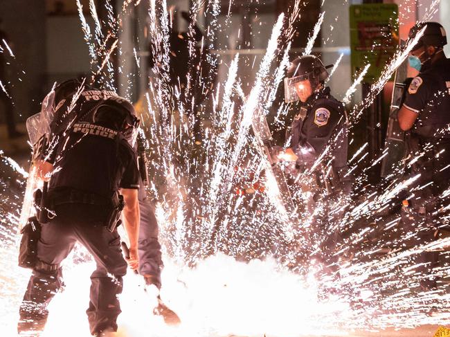 Cops deal with violence in Washington DC. Picture: AFP