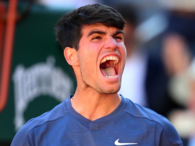 PARIS, FRANCE - JUNE 07: Carlos Alcaraz of Spain celebrates victory against Jannik Sinner of Italy during the Men's Singles Semi-Final match during Day Thirteen of the 2024 French Open at Roland Garros on June 07, 2024 in Paris, France. (Photo by Tim Goode/Getty Images)