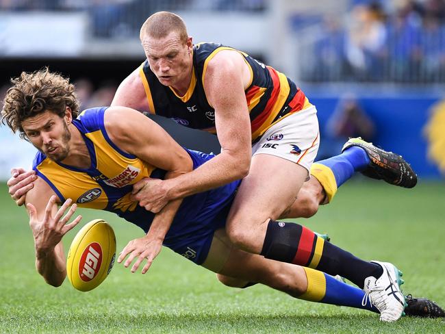 Sam Jacobs lays a tackle on Eagles ruckman Tom Hickey during his first game of AFL since round 2. Picture: DANIEL CARSON/AFL PHOTOS VIA GETTY IMAGES