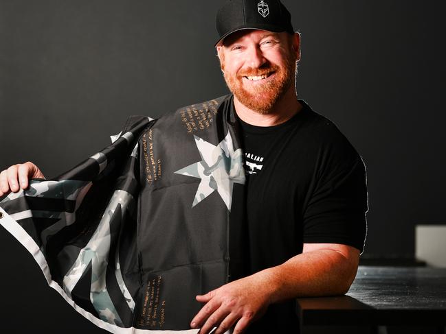 A military flag has been making its way around the nation garnering signatures from veterans to "raise the flag for mental health". Australian Warfighter Coffee owner Stewart Locke. Picture: Alix Sweeney