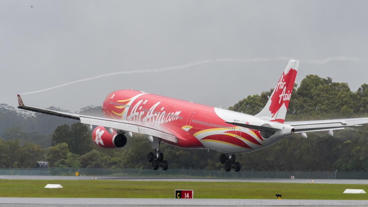 An Air Asia Airbus touches down at the Gold Coast. Photo: Mick McKean