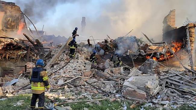 Firefighters at a school in eastern Ukraine's Lugansk region after a Russian missile attack. <br/>Picture: Ukrainian State Emergency Service