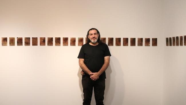 Khaled Sabsabi with his works at Mosman Art Gallery in 2019.