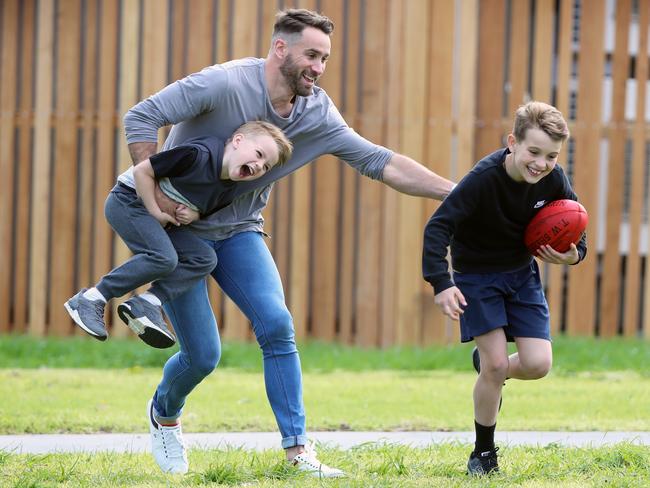 AFL star and former Carlton player Andrew Walker with his sons Cody, 9 and Arli, 5. He says the drug has changed his life and allowed him to play footy with his kids, and he's back on the field for a Division 1 local AFL club West Preston-Lakeside. Picture: Alex Coppel.