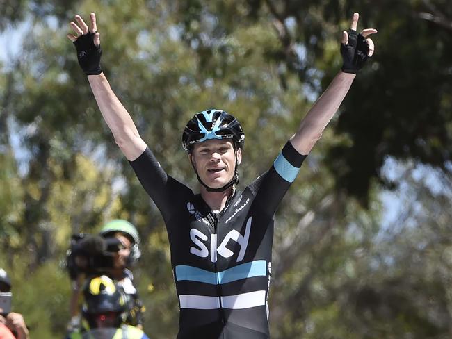 Chris Froome crosses the line.