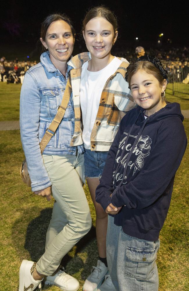 Kalah Lubbock with daughters Arya (centre) and Harper Lubbock at the Symphony Under the Stars concert performed by the Queensland Symphony Orchestra in Queens Park Amphitheatre for Carnival of Flowers, Friday, October 4, 2024. Picture: Kevin Farmer