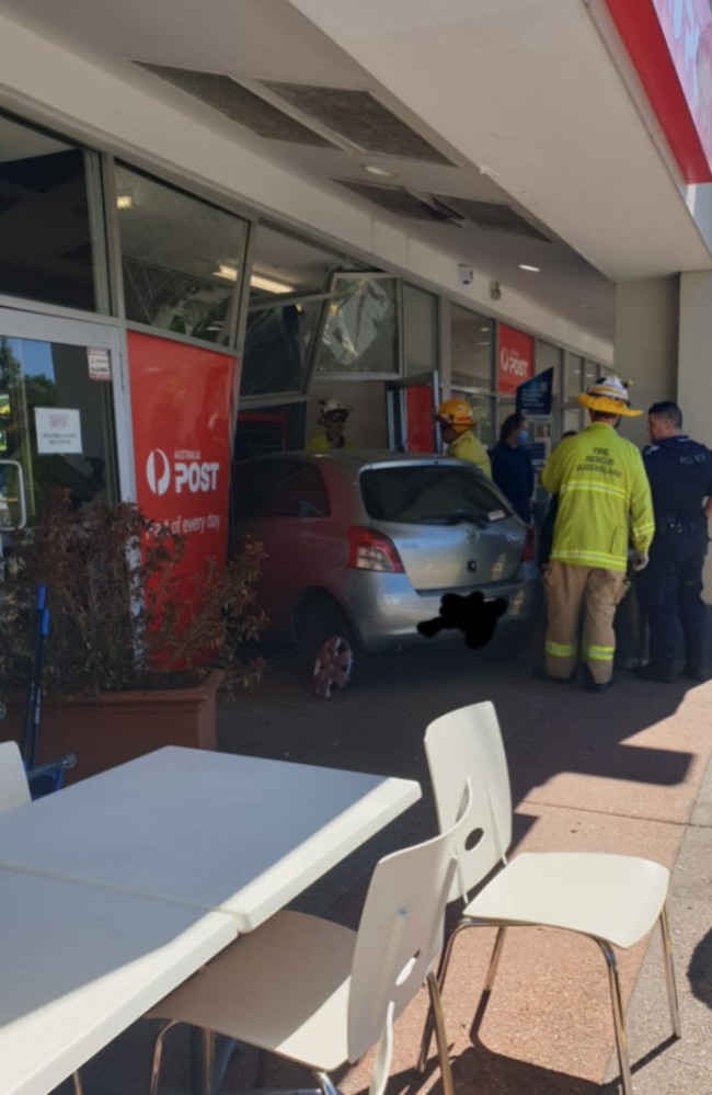 The car after it crashed through the front of the Kenmore Plaza post office. Picture: Paria Jalili