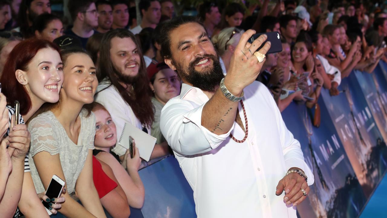 Jason Momoa takes a selfie with fans at the Australian premiere of Aquaman. Picture: Nigel Hallett