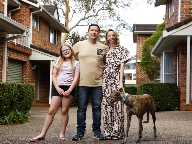 DAILY TELEGRAPH NOVEMBER 1, 2024. Alex Reid with his partner Jess McAviney and his daughter Sophie, 9, and dog Piper a home tin Miranda. The family are renting because it is too expensive to buy and they would happily move to Newcastle if a high speed rail option was available to them. Picture: Jonathan Ng