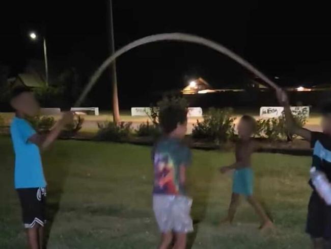 Queensland's environmental department are investigating a video showing several children in Woorabinda using a snake as a skipping rope.