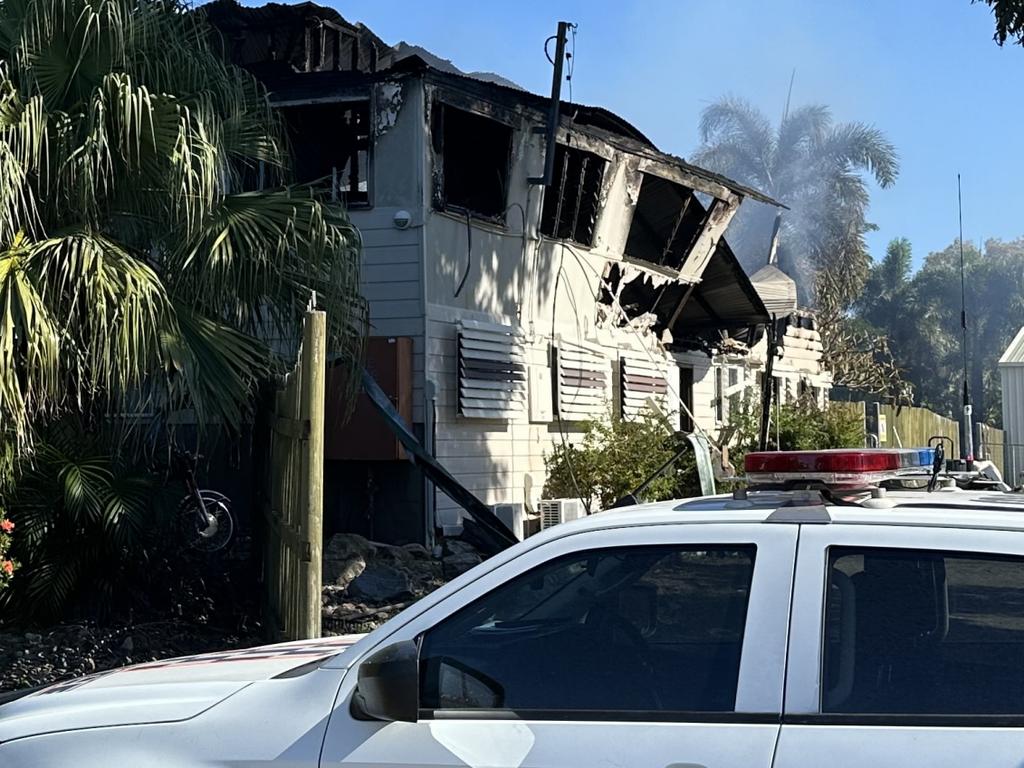 Police set up a crime scene at Barnacles Backpackers in Bowen after a fire engulfed the building, April 30, 2025