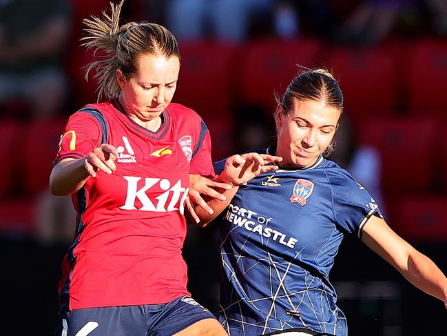 Dylan Holmes of Adelaide United and Claudia Cicco of the Newcastle Jets during the A-League Women round 22 match between Adelaide United and Newcastle Jets at Coopers Stadium, on March 29, 2024, in Adelaide, Australia. (Photo by Sarah Reed/Getty Images)