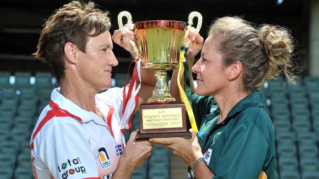 Women’s Grand Final Tahs captain Colleen Gwynne and Saints vice-captain Becky Taylor eye off the cup.