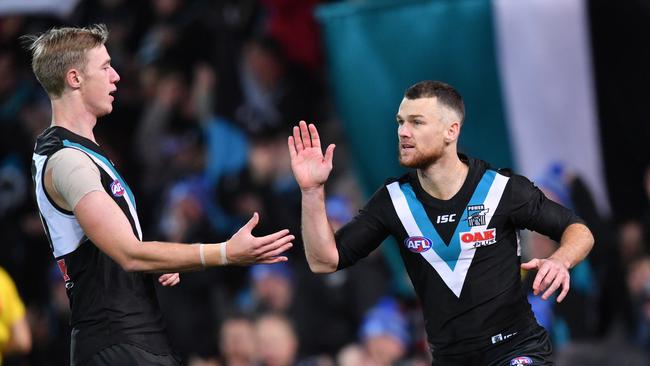 Robbie Gray celebrates a goal with Todd Marshall. Picture: AAP Image/David Mariuz