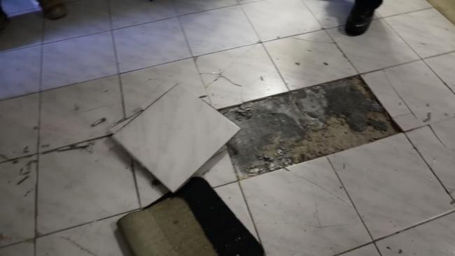 Residents work to a “crack and a pop” and found tiles bursting from the floor. Picture: NSW Fire and Rescue