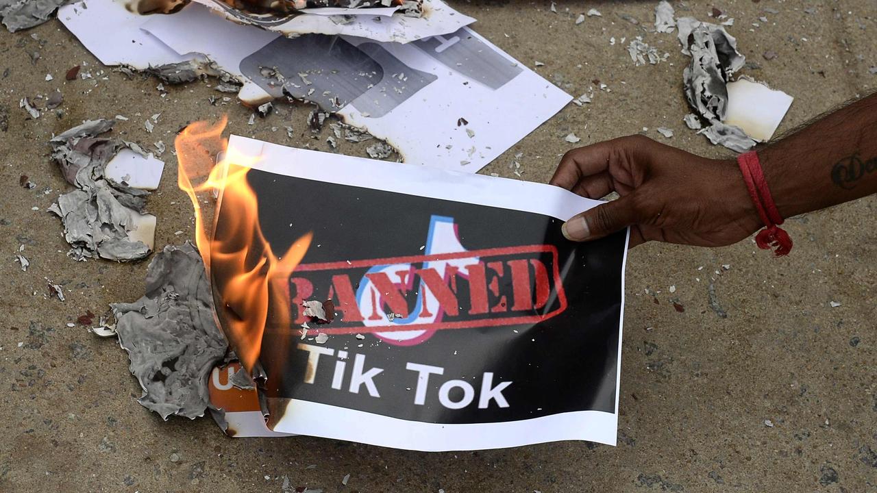 Members of the City Youth Organisation in Hyderabad burn TikTok logos in support of the Indian government’s ban. Picture: Noah Seelam/AFP