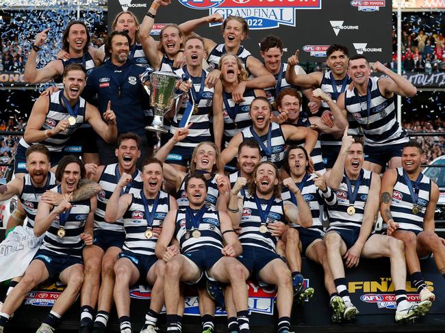 MELBOURNE, AUSTRALIA - SEPTEMBER 24: The Cats celebrates on the dais during the 2022 Toyota AFL Grand Final match between the Geelong Cats and the Sydney Swans at the Melbourne Cricket Ground on September 24, 2022 in Melbourne, Australia. (Photo by Michael Willson/AFL Photos via Getty Images)