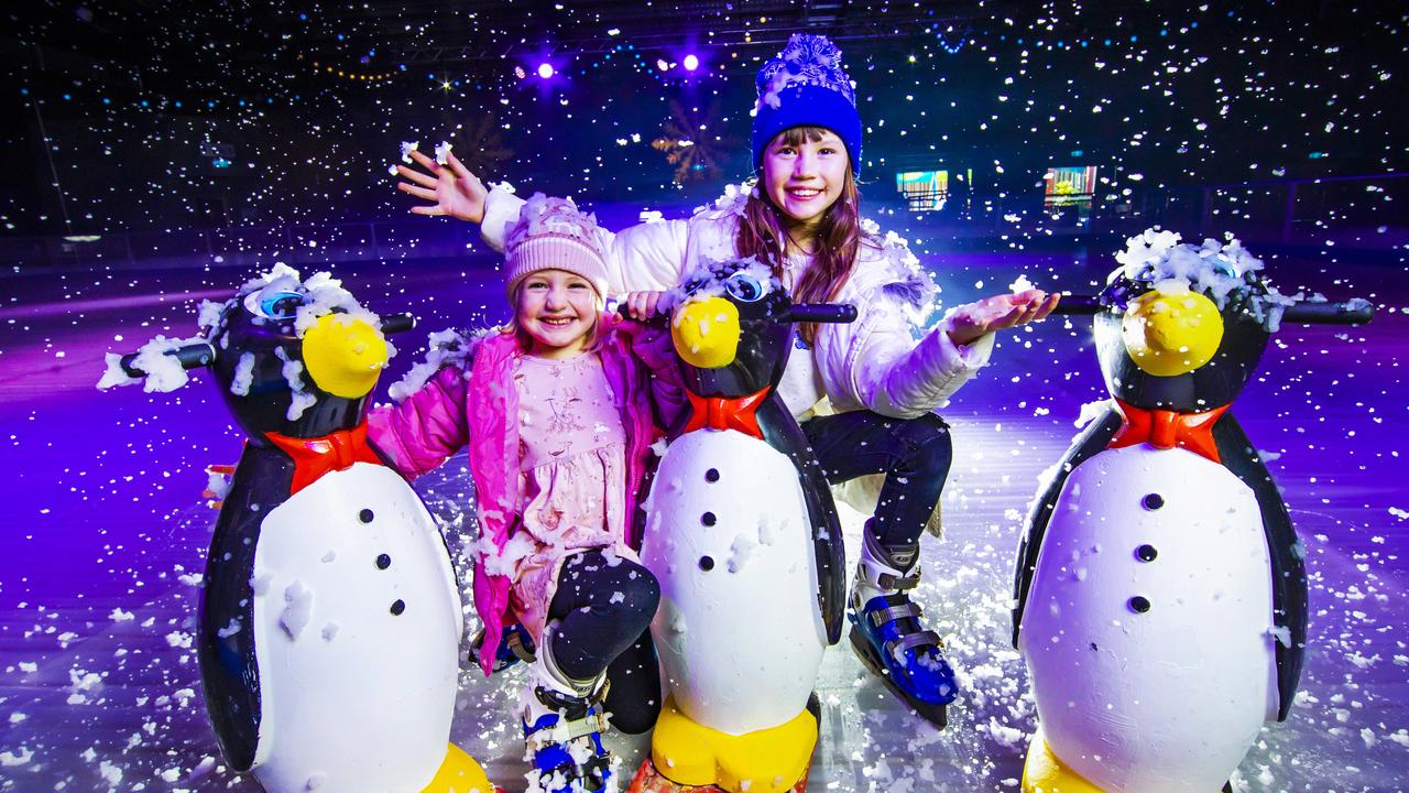 Piper Erasmus, 4 and Esther Yong, 9 at Dreamworld’s Winterfest which opens for the school holidays. Picture: Nigel Hallett