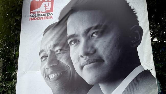 Election poster showing Indonesian President Joko Widodo and his youngest son Kaesang under the caption “Generation Optimism” Picture: Supplied