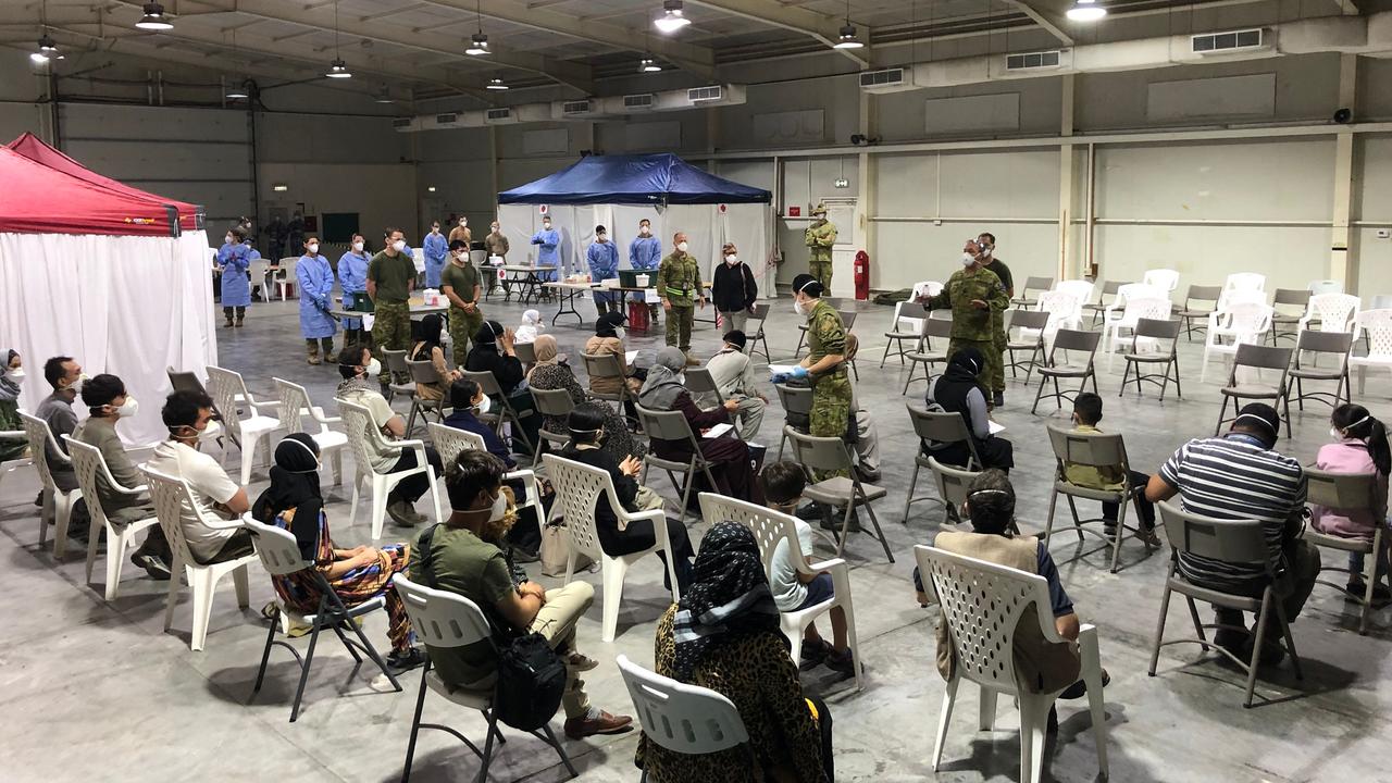 Passengers being processed at Australia's main base in the Middle East region.