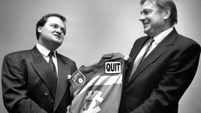 Footscray president Peter Gordon and Fitzroy counterpart Dyson Hore-Lacy with the proposed merger jumper in 1990.