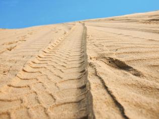 Car tracks on sand. Picture: iStock 