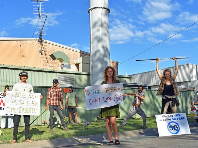 Anti 5G protesters, second from left Lex Richards, far right Ria Mithya, second right David Skywalker at the communications tower in Daley St in Mullumbimby.