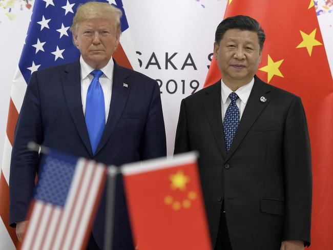 US President Donald Trump, left, poses for a photo with Chinese President Xi Jinping during a meeting on the sidelines of the G-20 summit in Osaka, Japan, June 29, 2019. Picture: AP Photo/Susan Walsh, File