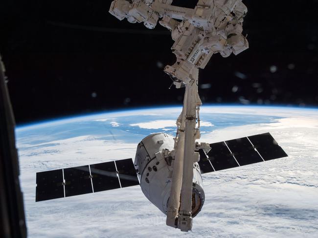 The Candarm2 robotic arm of the International Space Station tries to grapple the SpaceX Dragon ship on Jan. 12 2015, two days after its launch from the Cape Canaveral Air Force Station, Florida. Picture: AFP/NASA