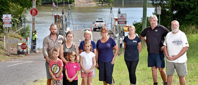 Concerned Lower Portland residents Craig and Rochelle Miller with their children Jay, 7, Capri, 6, & Grace, 8, Jo Arblaster, Janet Kousal, Krystal Sinclair, Dave Ingram & Don Wilson near the river ferry at Lower Portland on Tuesday, April 16. Local residents would be impacted by the closure of the Lower Portland Ferry. AAP IMAGE / Troy Snook